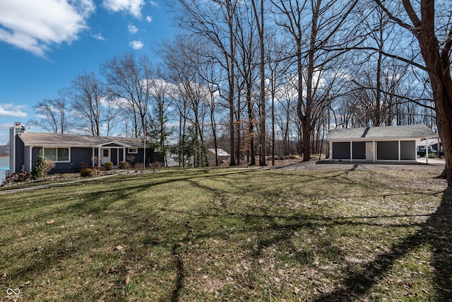 view of yard featuring a garage