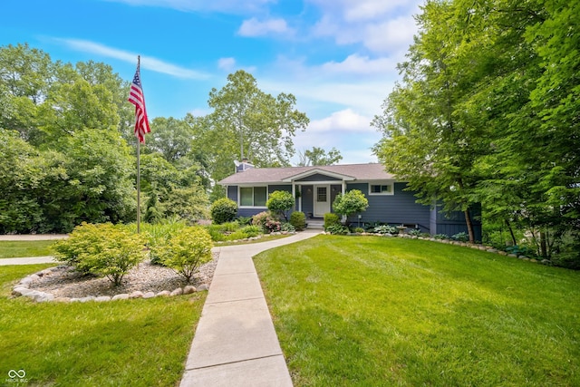7600 N Blue Heron Dr, Unionville, IN 47468 - view of front of property with a front yard and a chimney