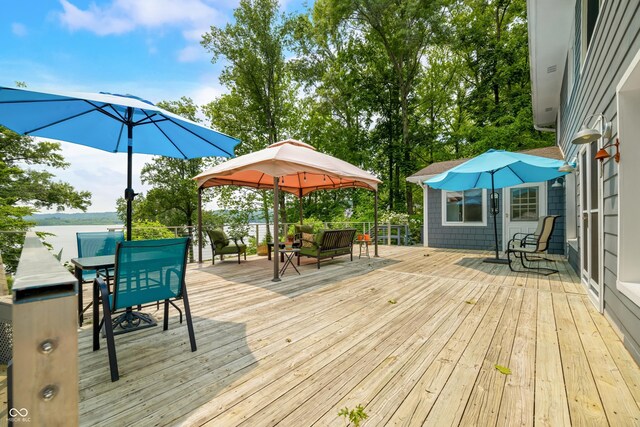 7600 N Blue Heron Dr, Unionville, IN 47468 - wooden terrace featuring an outdoor hangout area, outdoor dining area, and a gazebo