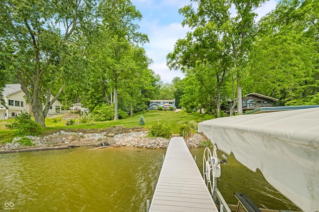 7600 N Blue Heron Dr, Unionville, IN 47468 - dock area featuring a water view, view of scattered trees, and a yard