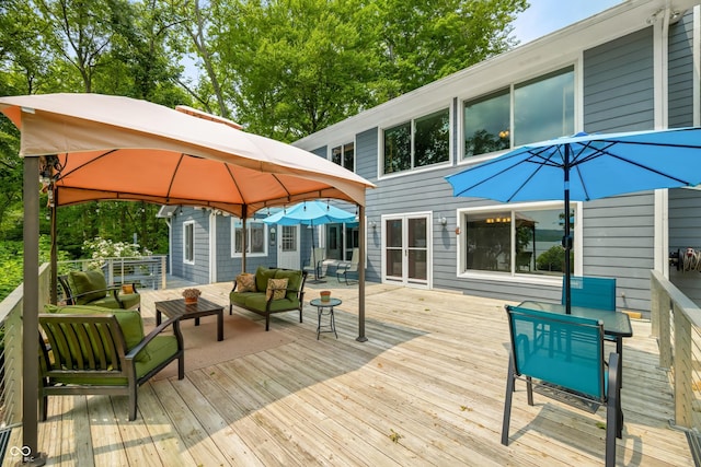 7600 N Blue Heron Dr, Unionville, IN 47468 - wooden deck featuring a gazebo, an outdoor hangout area, and outdoor dining space
