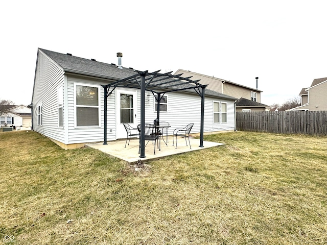 back of house with a patio area, a lawn, fence, and a pergola