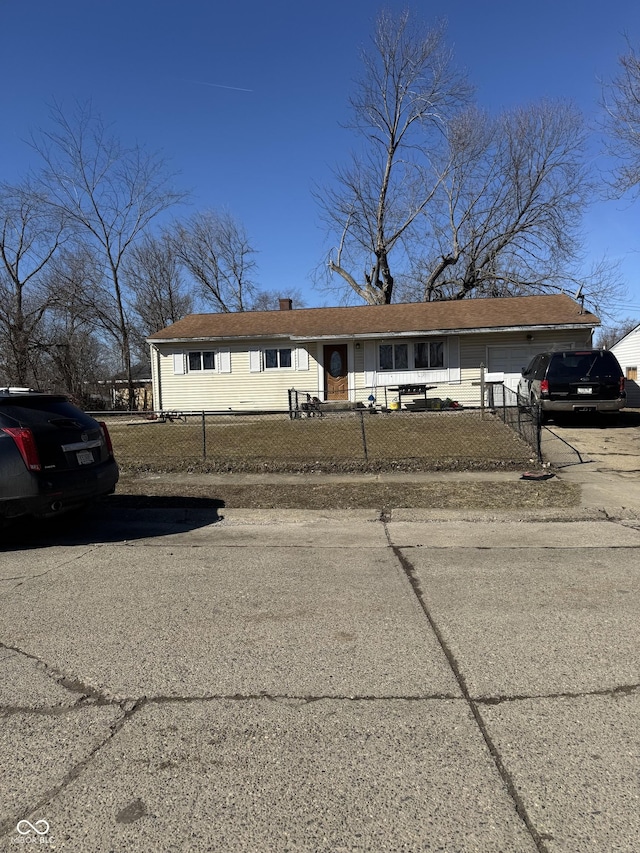 view of front facade featuring a fenced front yard and a chimney