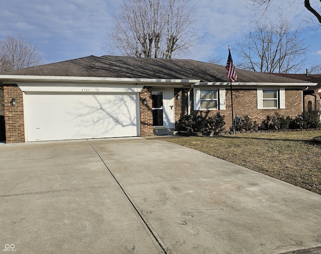 single story home featuring an attached garage, concrete driveway, and brick siding