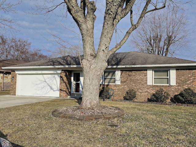 single story home featuring a garage, concrete driveway, and brick siding