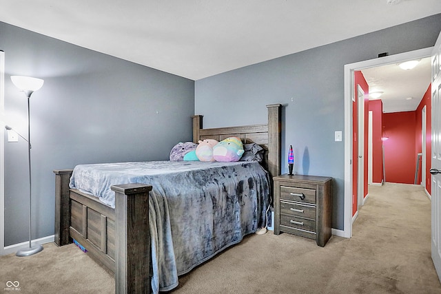 bedroom featuring baseboards and carpet flooring