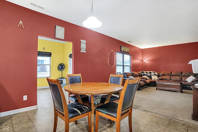 dining space with visible vents and baseboards