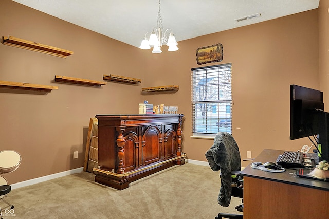 office space with a notable chandelier, carpet floors, visible vents, and baseboards