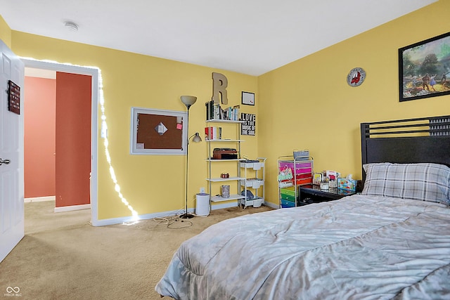 carpeted bedroom with baseboards