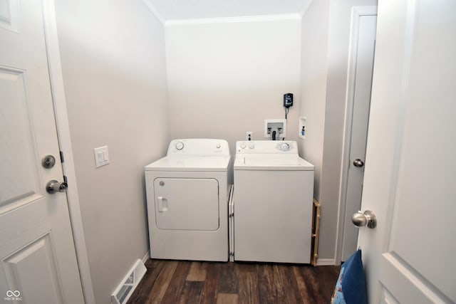 clothes washing area featuring laundry area, visible vents, dark wood finished floors, crown molding, and separate washer and dryer