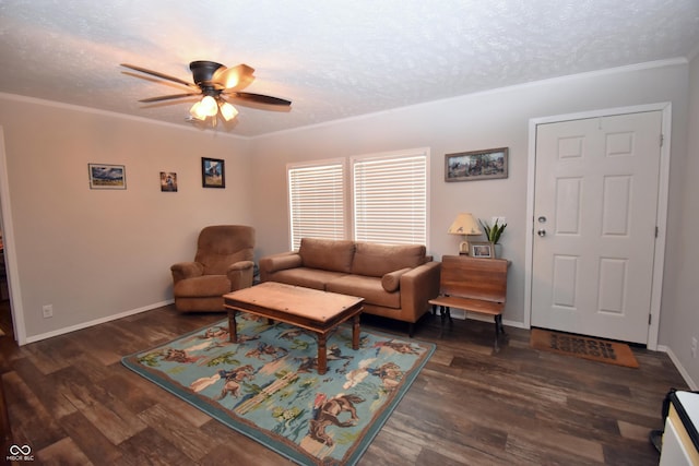 living area with a textured ceiling, wood finished floors, and crown molding