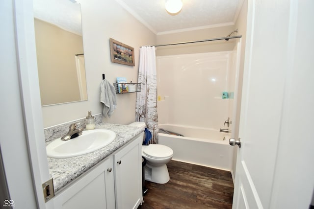 full bath featuring toilet, wood finished floors, vanity, shower / bath combo, and crown molding