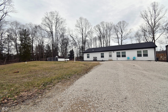 ranch-style house with gravel driveway