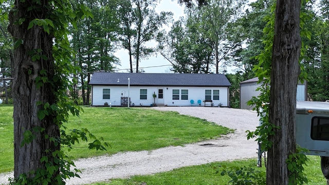 9191 W Mt Carmel Rd, Gosport, IN 47433 - ranch-style home with a front yard and an outbuilding