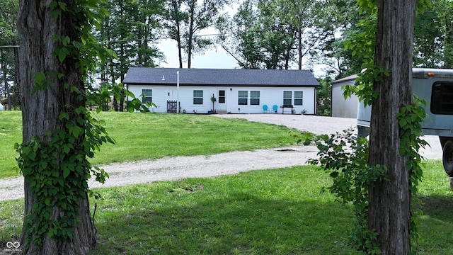 9191 W Mt Carmel Rd, Gosport, IN 47433 - single story home with a front yard and an outbuilding