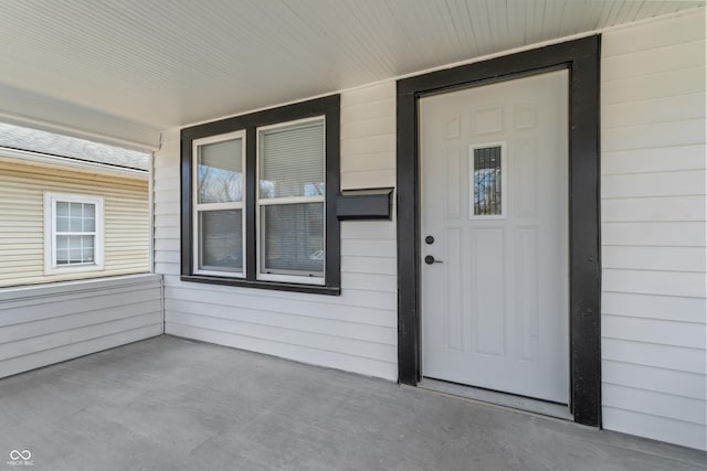 doorway to property featuring a porch