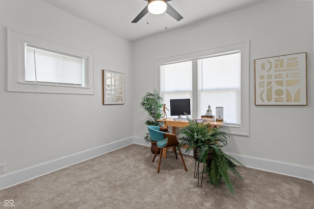 office featuring carpet, a ceiling fan, and baseboards