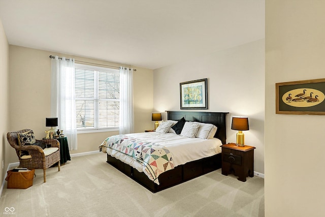 carpeted bedroom with baseboards