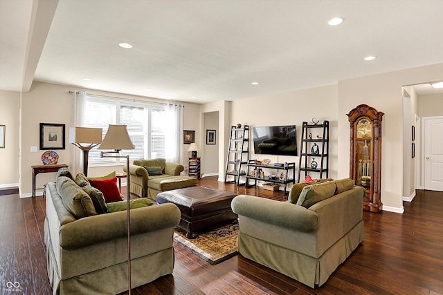 living area with recessed lighting, dark wood-style flooring, and baseboards