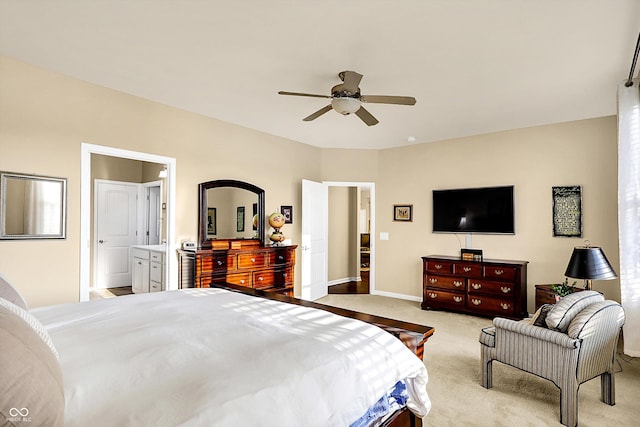 bedroom featuring light colored carpet, baseboards, and ceiling fan