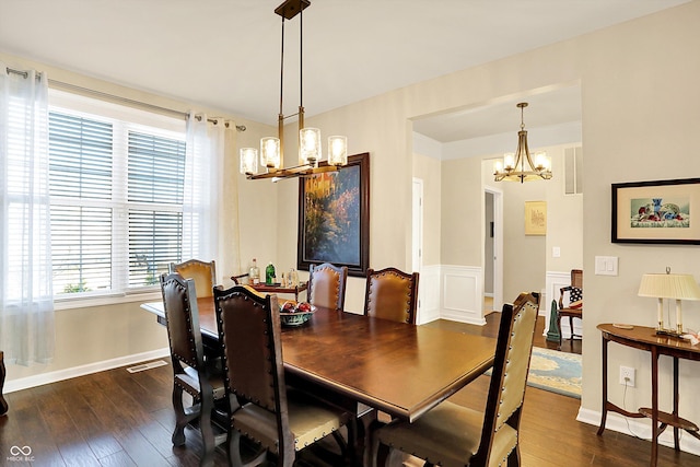 dining room featuring visible vents, baseboards, an inviting chandelier, and dark wood-style flooring