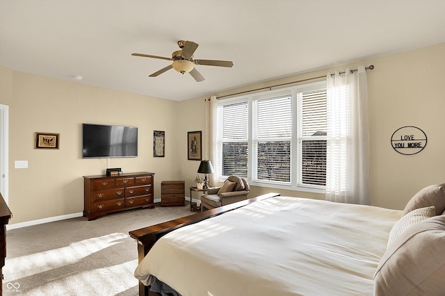 bedroom featuring baseboards, carpet, and a ceiling fan