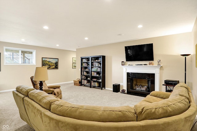 carpeted living room with recessed lighting, a tile fireplace, and baseboards