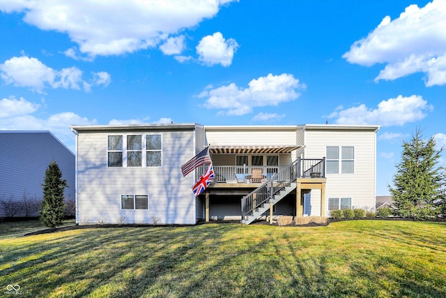 back of house with a lawn, a wooden deck, and stairs