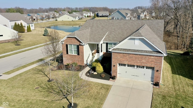 view of front facade featuring brick siding, a residential view, driveway, and roof with shingles