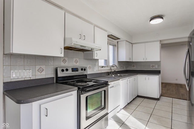 kitchen with dishwasher, dark countertops, stainless steel electric stove, under cabinet range hood, and a sink