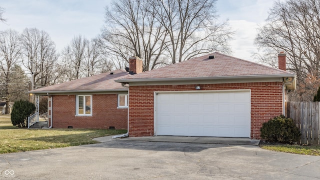 view of front of house with driveway, a chimney, crawl space, fence, and brick siding