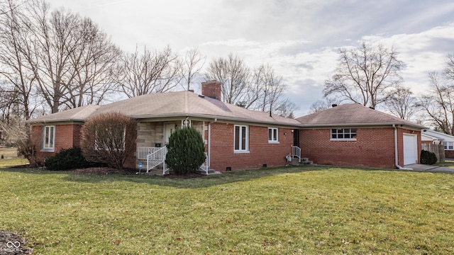 view of side of property featuring a yard, a chimney, and brick siding