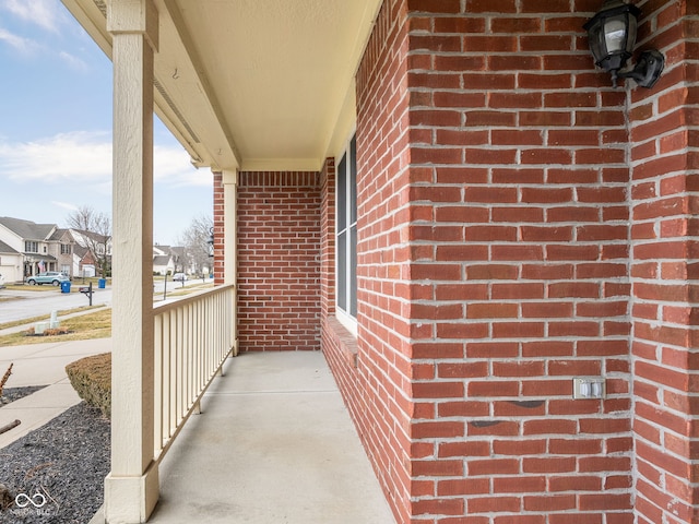 balcony with covered porch and a residential view