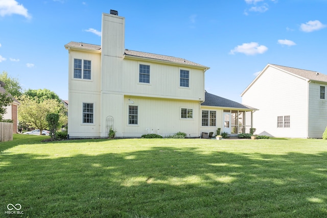 11866 Weathered Edge Dr, Fishers, IN 46037 - back of house with a yard, a chimney, and a shingled roof