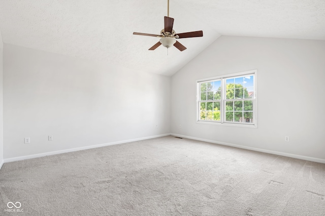 11866 Weathered Edge Dr, Fishers, IN 46037 - empty room featuring vaulted ceiling, ceiling fan, carpet, and baseboards