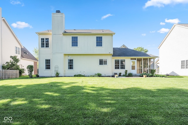 11866 Weathered Edge Dr, Fishers, IN 46037 - rear view of house featuring a chimney, a sunroom, and a lawn
