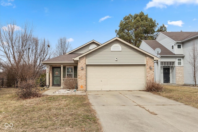 view of front of property with brick siding, concrete driveway, an attached garage, fence, and a front yard