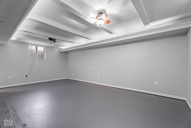 basement featuring a ceiling fan and baseboards