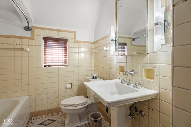 full bathroom with lofted ceiling, a shower, tile walls, toilet, and a bathtub