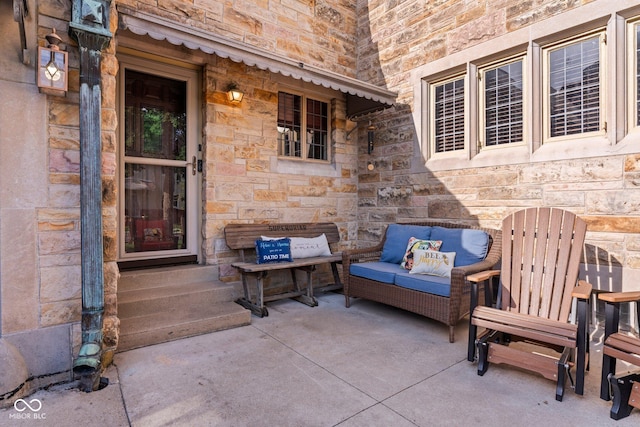 view of patio with outdoor lounge area and entry steps