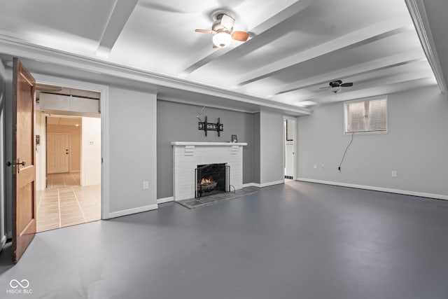 basement featuring a fireplace, a ceiling fan, and baseboards