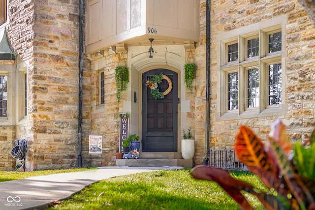 property entrance with stone siding