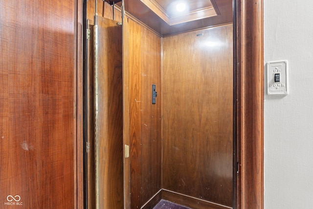 interior details featuring a tray ceiling and crown molding