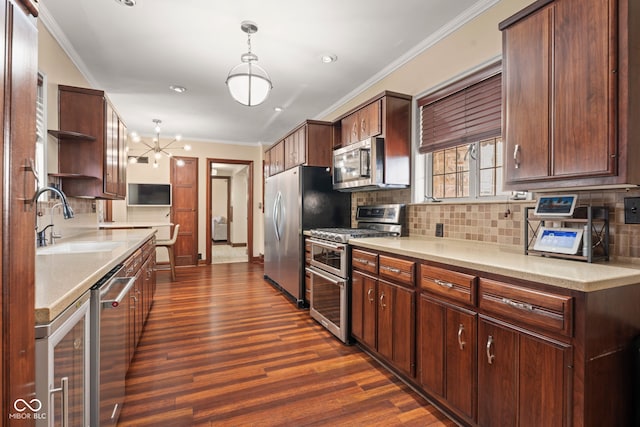 kitchen featuring ornamental molding, a sink, open shelves, appliances with stainless steel finishes, and dark wood-style flooring