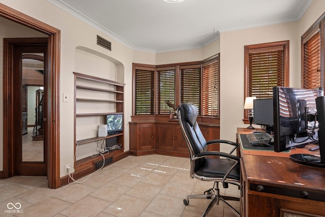 home office with light tile patterned floors, visible vents, built in shelves, and ornamental molding