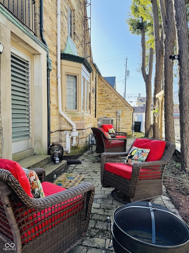 view of patio with central AC unit and an outdoor hangout area