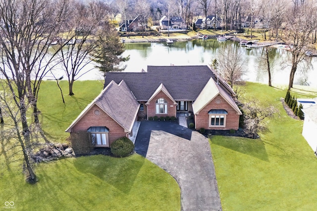 birds eye view of property featuring a water view