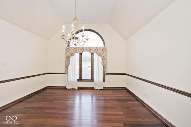 unfurnished room with a chandelier, lofted ceiling, baseboards, and wood finished floors