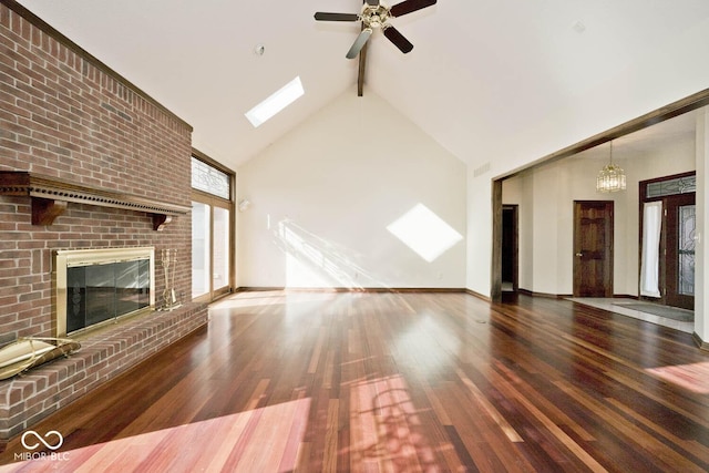 unfurnished living room with high vaulted ceiling, a fireplace, wood finished floors, baseboards, and beamed ceiling