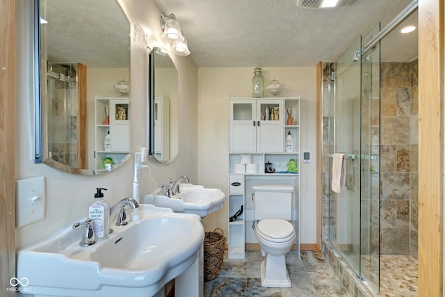 full bath with a stall shower, a sink, and toilet